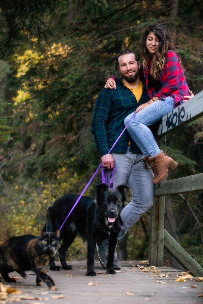 couple with a dog and cat