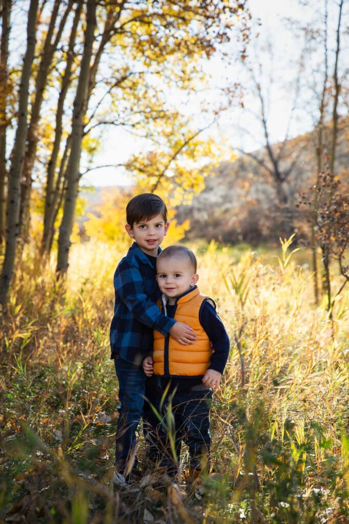 two kids in dry grass