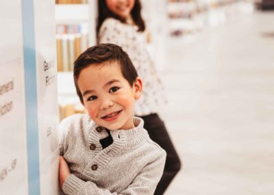 kids playing among bookshelves